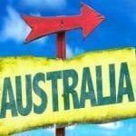 Sign with Australia written on it and an arrow pointing to the left.